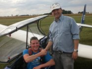 Instructor Steve Bonser congratulates Guy after his first solo flight